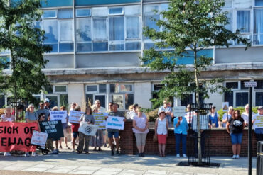 People standing outside county hall for Southern Water Protest