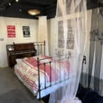 Sweet Dreams exhibition showing the bed and piano