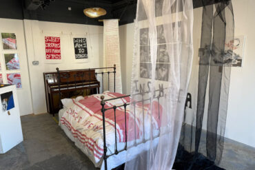 Sweet Dreams exhibition showing the bed and piano