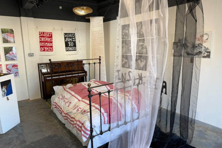 Sweet Dreams exhibition showing the bed and piano