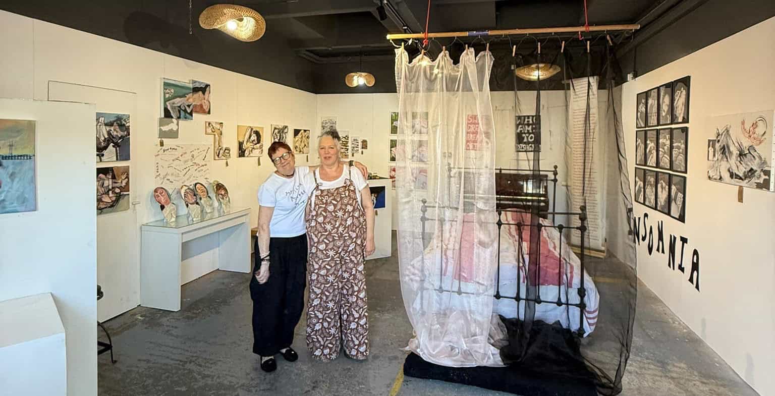 Sandy and Wendy after setting up the exhibition