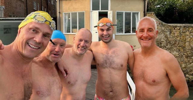 The five members of the Swimming Gang in trunks and swimming caps