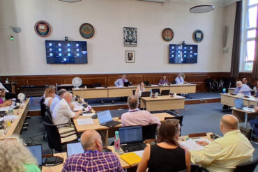 IWC IWC full council meeting with councillors sitting in the chamber jul 2026