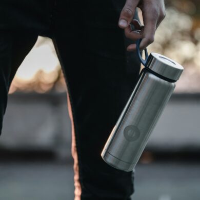 man holding reusable water bottle