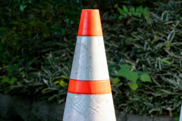 road cone on the back of a truck