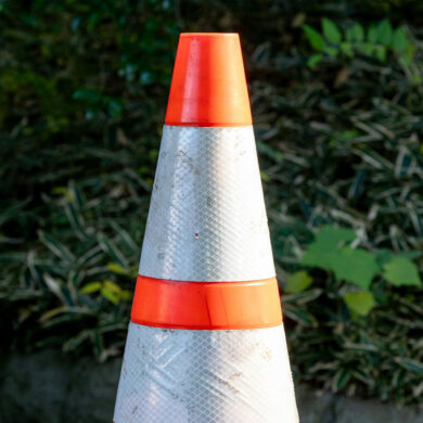 road cone on the back of a truck