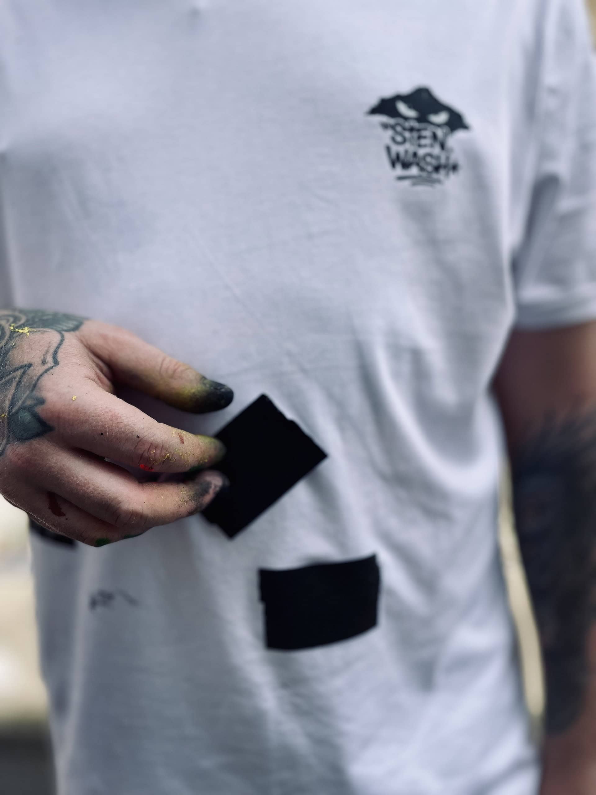 Close up of Masked graffiti artist with spray paint on fingers