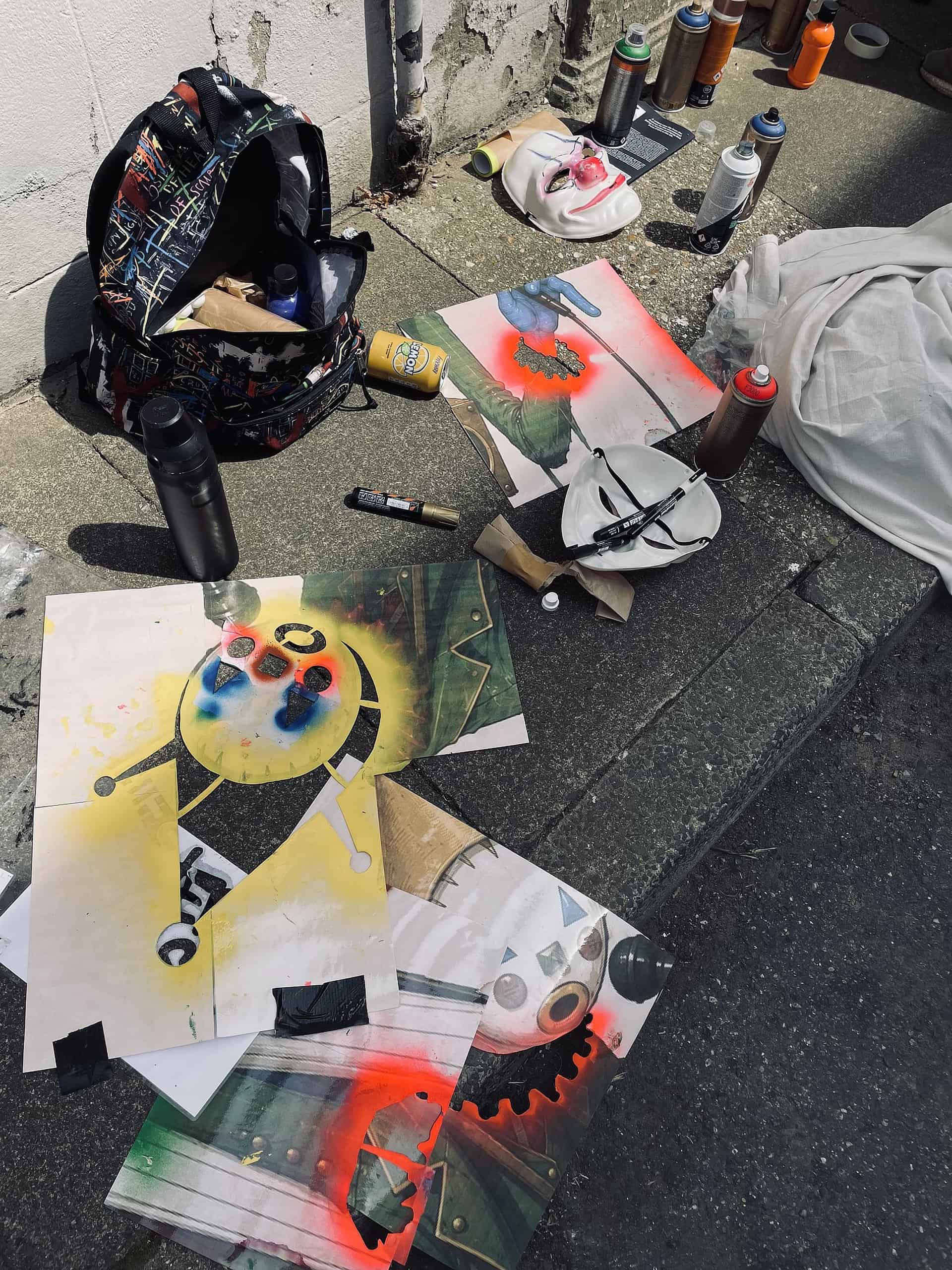 The tools for graffiti artist workings on Sandown Clown street art
