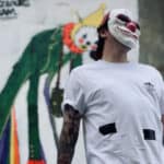 Portrait of masked graffiti artists who worked on Sandown Clown street art