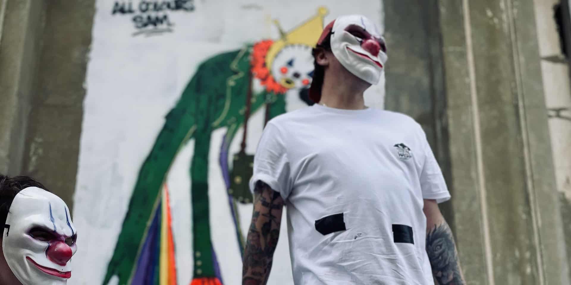 Portrait of masked graffiti artists who worked on Sandown Clown street art