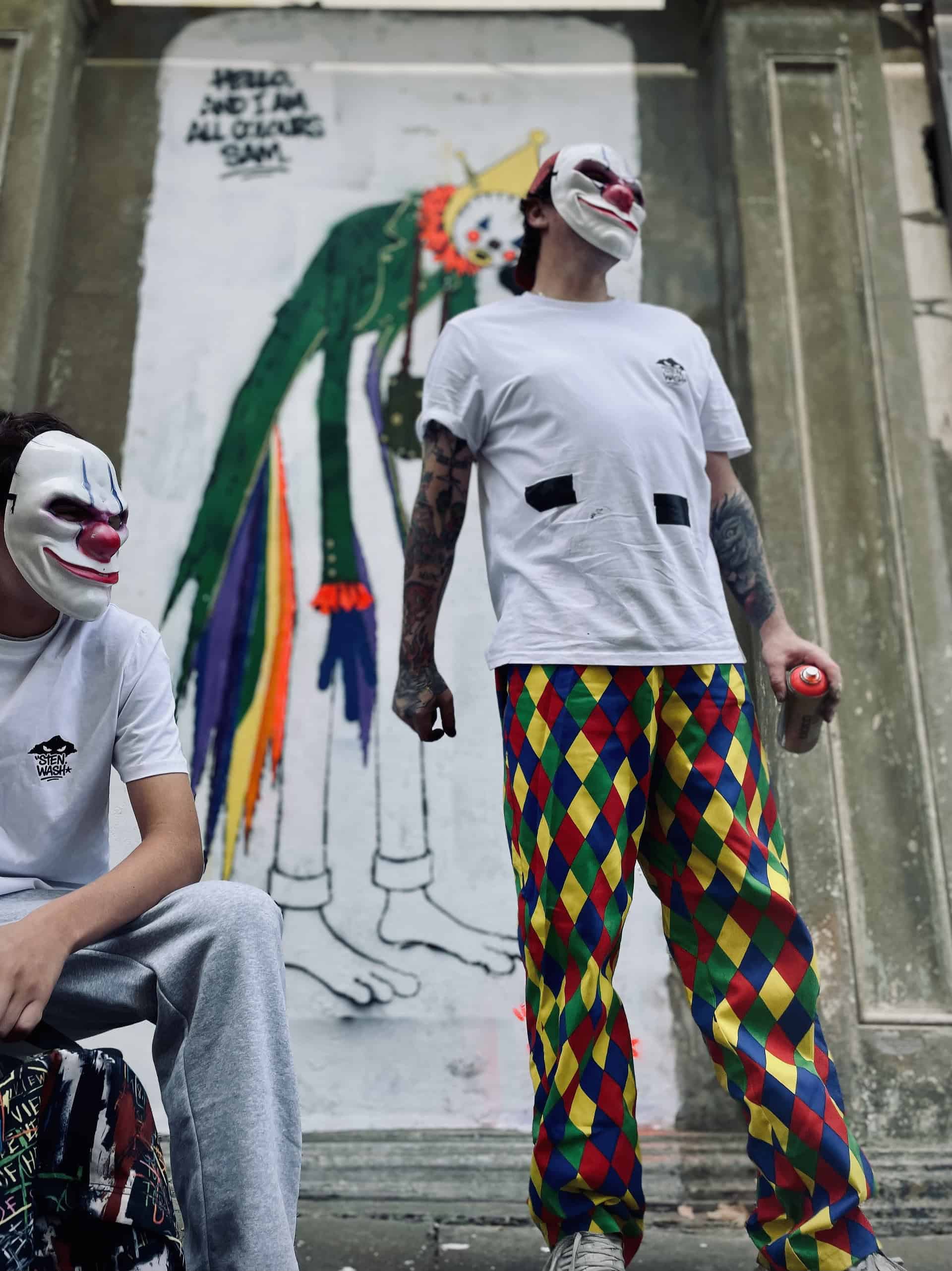 Portrait of masked graffiti artists who worked on Sandown Clown street art