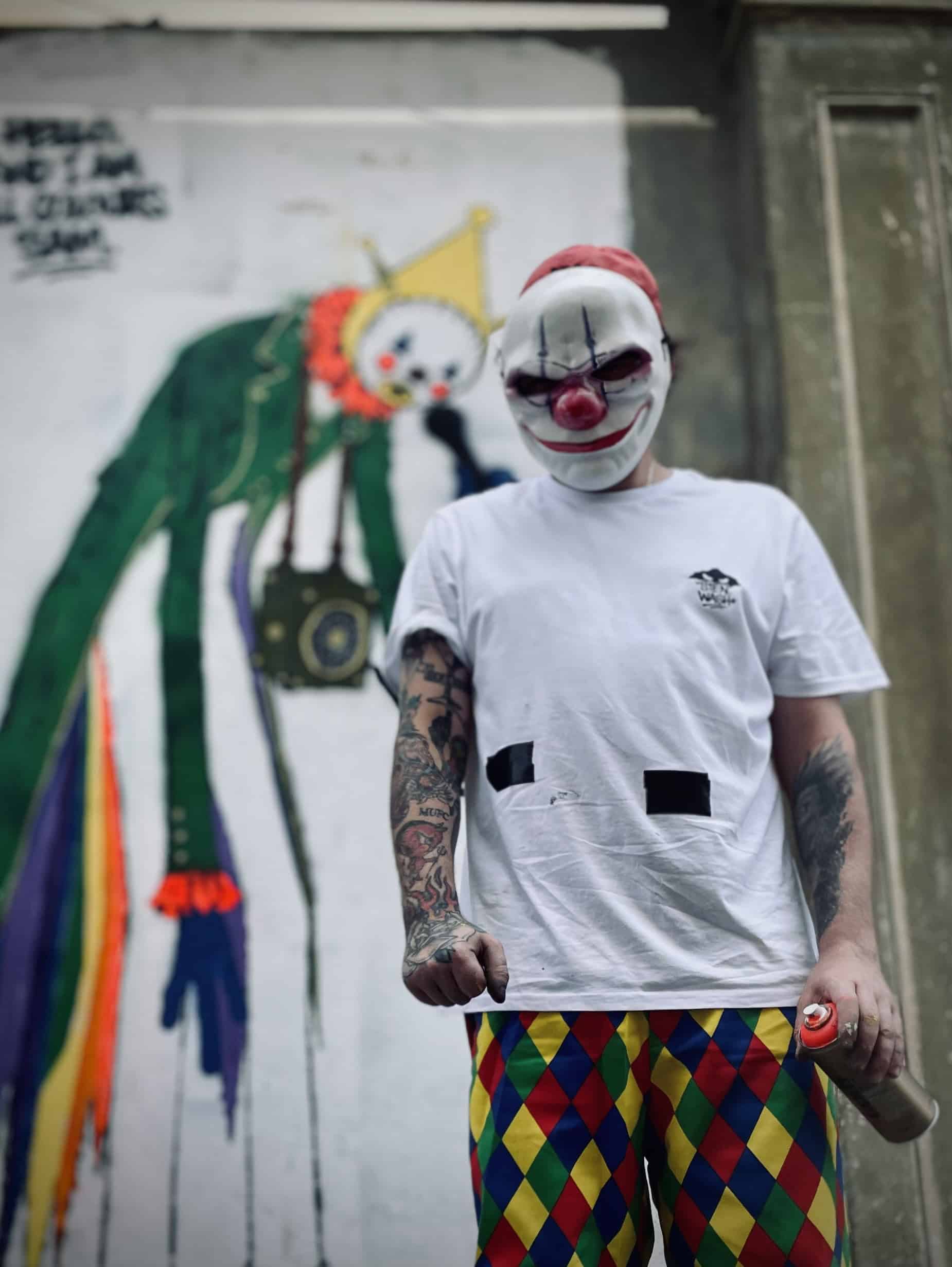 Portrait of masked graffiti artist who worked on Sandown Clown street art