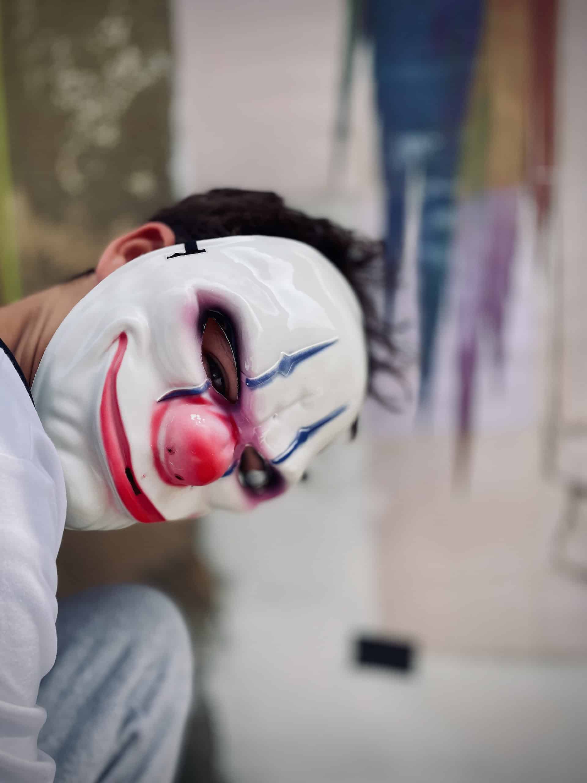 Masked graffiti artists preparing Sandown Clown street art