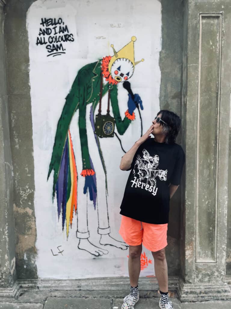 Tracy from Boojum & Snark looking at the completed Sandown Clown street art