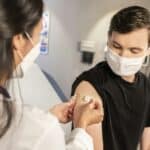 young person being vaccinated