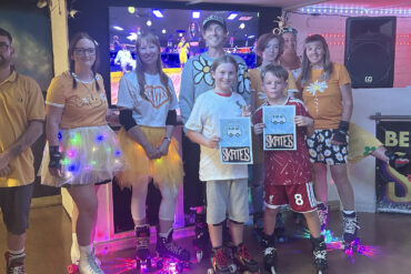 Adults and children with roller skates on