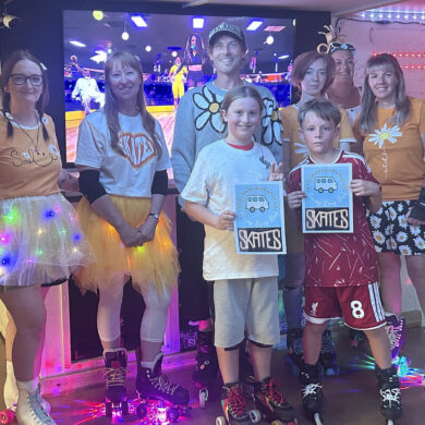 Adults and children with roller skates on