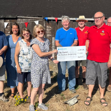 Shed members with Trustees accepting a Donation to the Haven