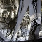 Painted fabric draping into a pond