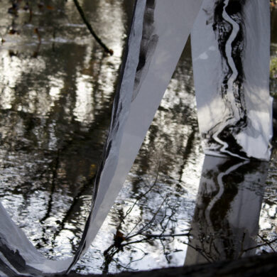 Painted fabric draping into a pond
