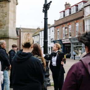 Charlotte at St Thomas's square speaking to walking tour audience