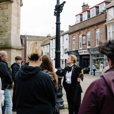 Charlotte at St Thomas's square speaking to walking tour audience