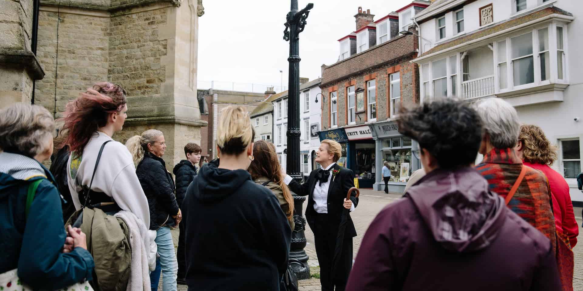 Charlotte at St Thomas's square speaking to walking tour audience