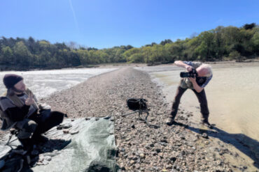 Pete Johnstone taking photos of fisherman Joe Sanders
