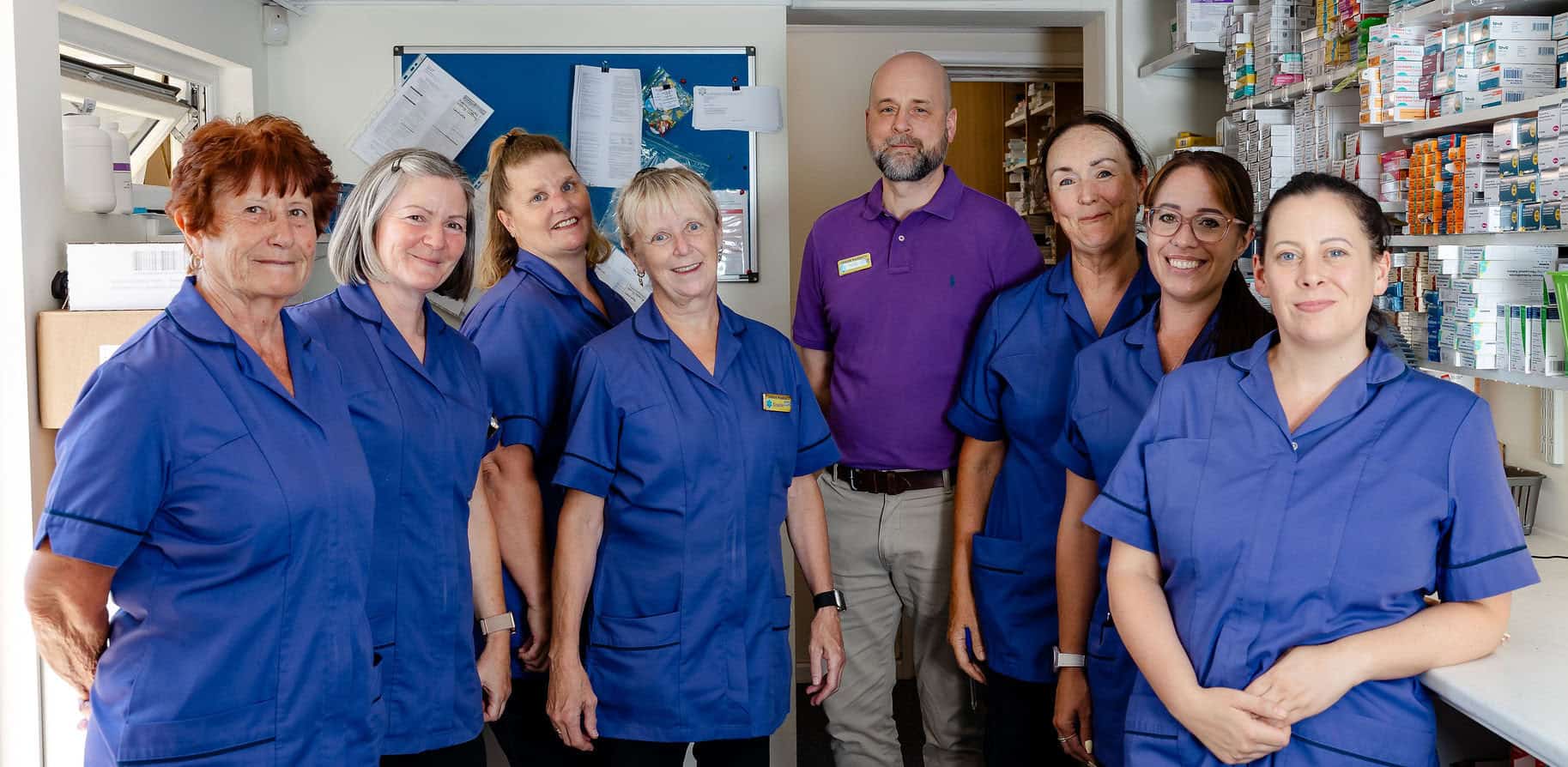 Pharmacy team posing for photograph