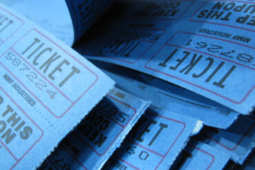 A book of blue Raffle tickets