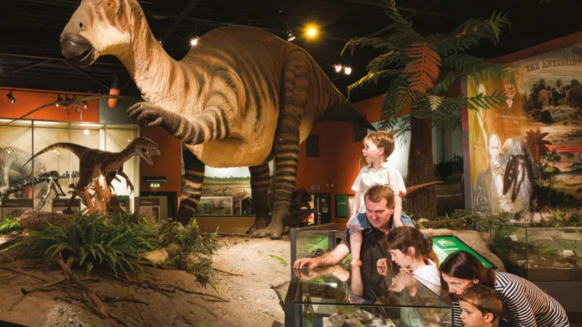 A family inside Dinosaur Isle