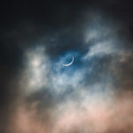 partial solar eclipse on a cloudy day
