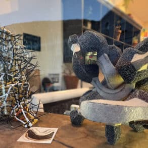 Two of steve baxter's sculptures in the window of Gallery 44