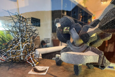 Two of steve baxter's sculptures in the window of Gallery 44