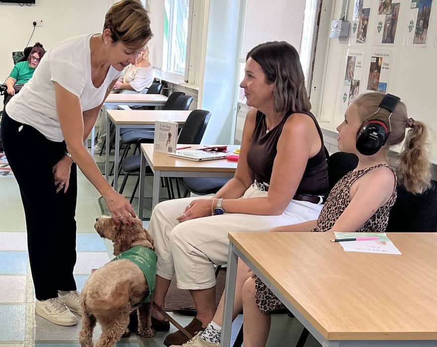 Katy talking to people at training session with their Ability dogs