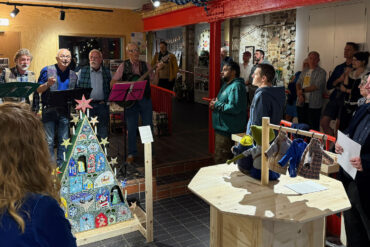 The opening night of the Common Place exhibition, with Brighstone Barnacles group singing shanties