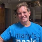 TV Chef Matt Tebbutt is showing his support for school feeding charity by wearing the T-shirt and drinking from a Mary's Meals mug