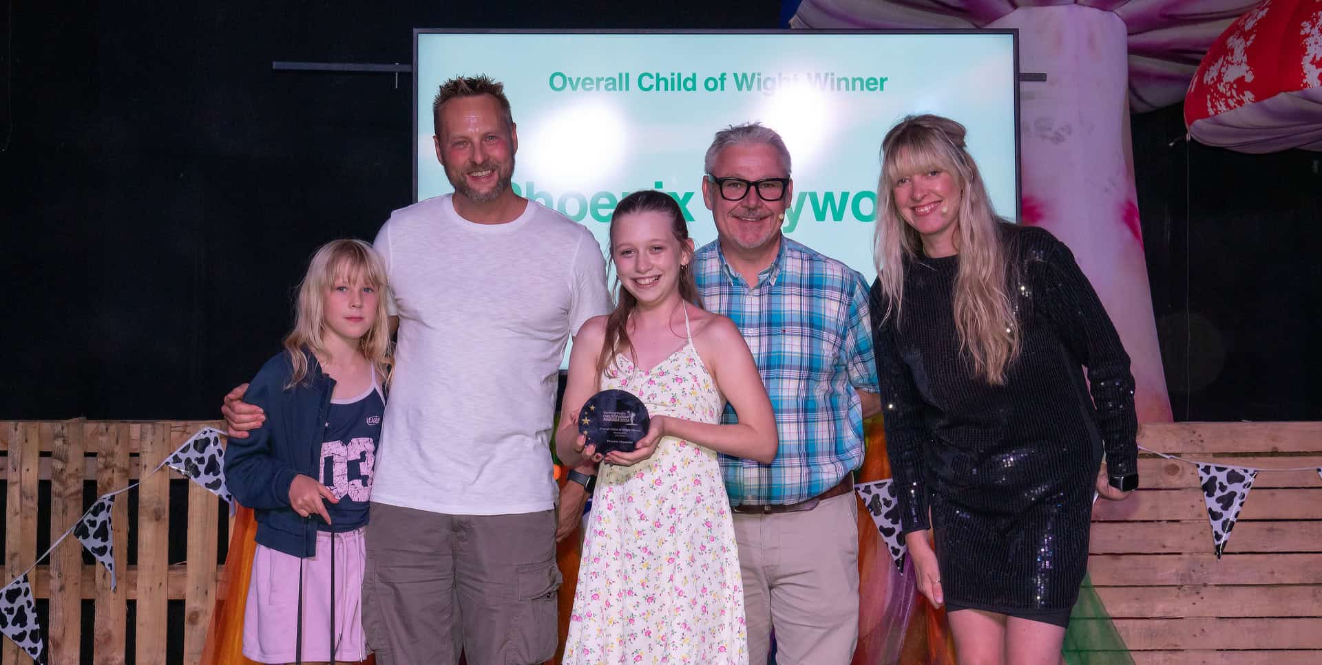 Overall Child of Wight Phoenix Hayward on stage receiving her award