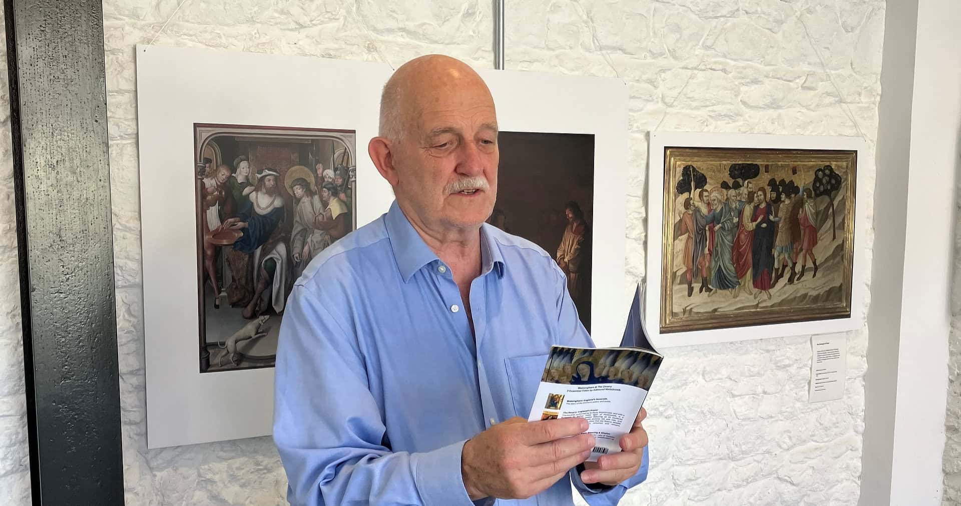 Man reading aloud from a booklet