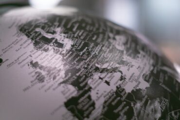 black and white photo of a world globe