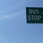 bus stop sign against blue sky
