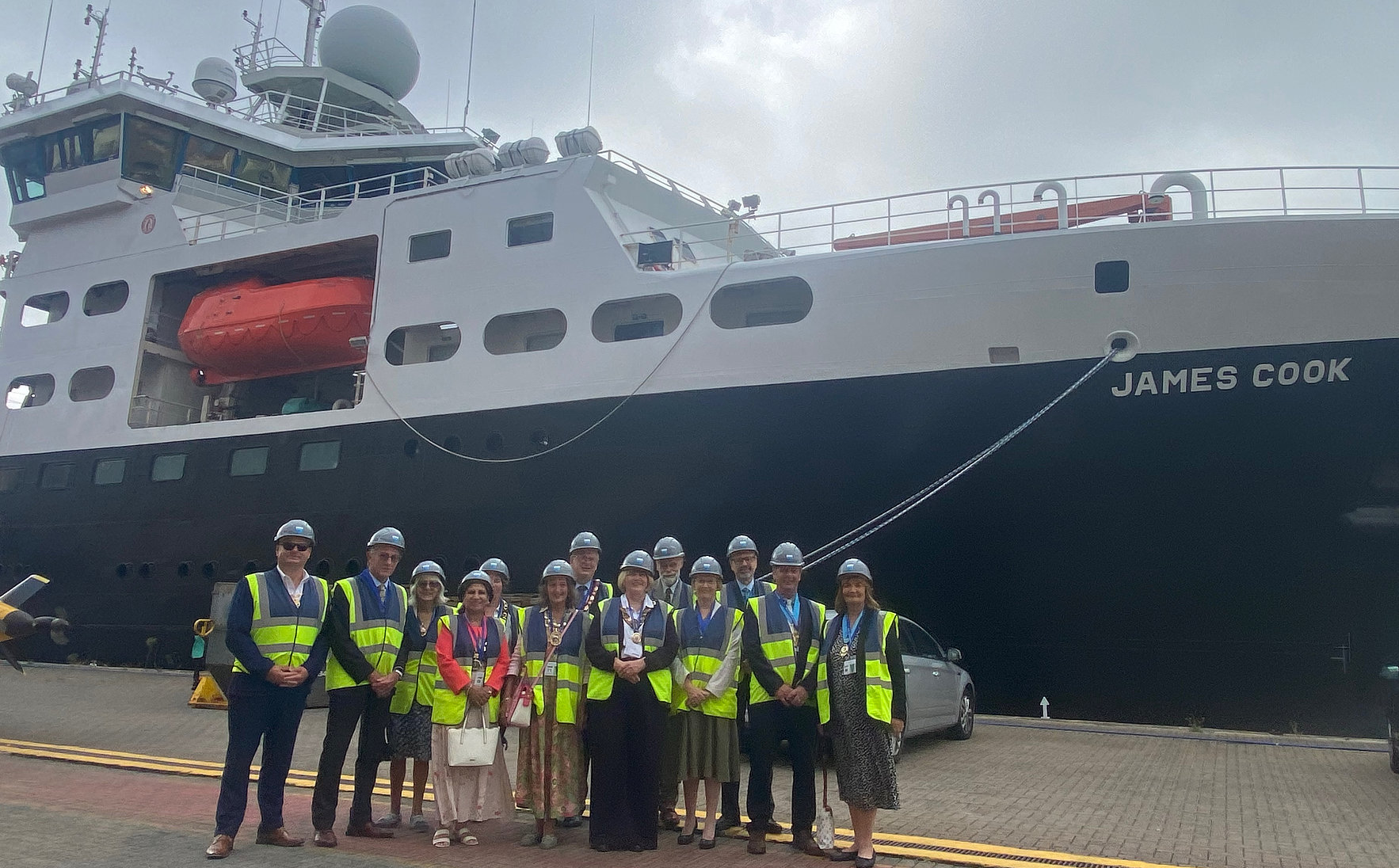 Ian Dore with others by dockside