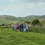 people walking across country