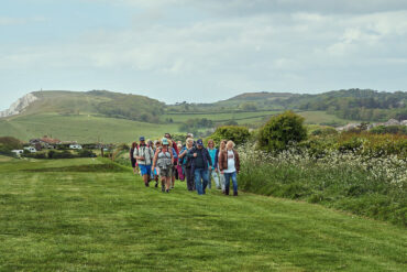 people walking across country