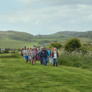 people walking across country