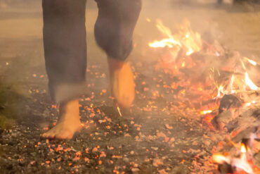 Person walking on the hot coal fire