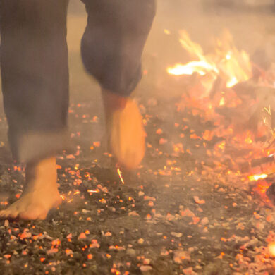 Person walking on the hot coal fire