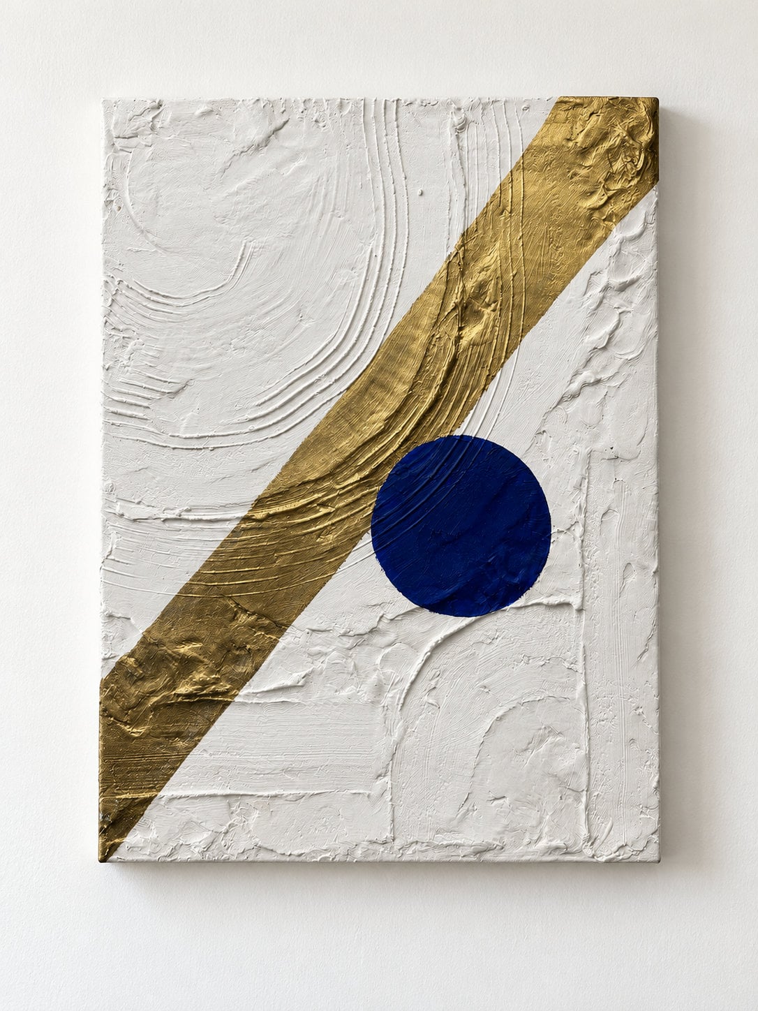 White painting with a blue circle on it and gold line running from top to bottom