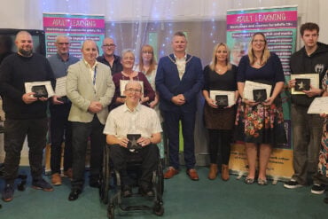 Award winners with their certificates