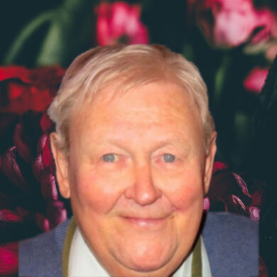 Bouquet of flowers on a dark background with photo of Ken Matthews on top